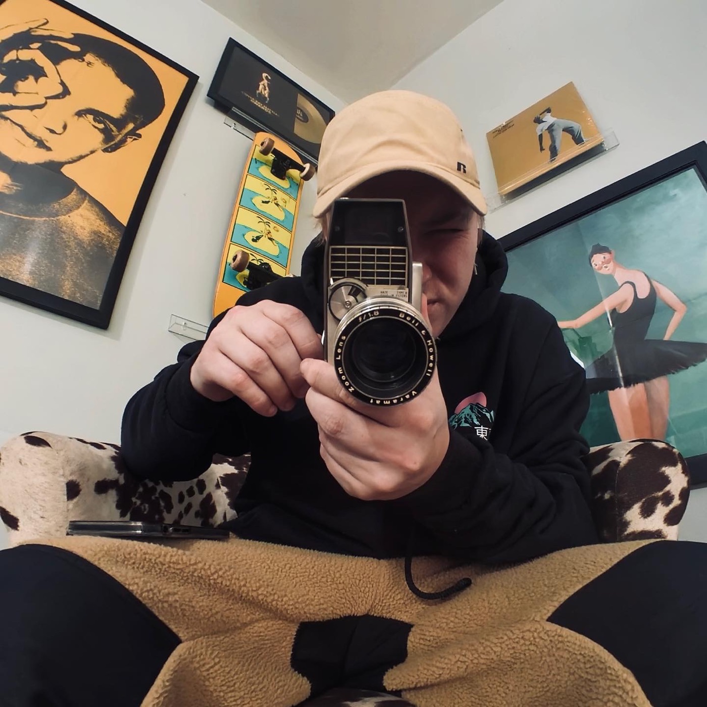 Dameon Spencer filming with a vintage Bell and Howell film camera